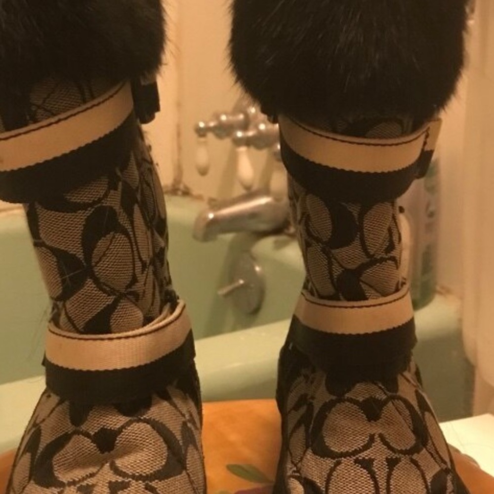 Coach boots with black fur at top. white straps